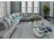 Elegant living room showcasing plush sofa, modern decor, and natural light at 7550 John Hancock Dr, Winter Garden, FL 34787