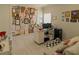Bright home office with brick accent wall, desk, cork board and plenty of light at 7550 John Hancock Dr, Winter Garden, FL 34787