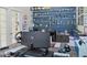 Stylish office featuring modern desk, display shelves with trophies, and a bright, professional setting at 7550 John Hancock Dr, Winter Garden, FL 34787