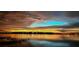 Gorgeous sunset over the water and the neighborhood creates a picturesque view at 7550 John Hancock Dr, Winter Garden, FL 34787