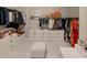 Well-organized walk-in closet with shelving, drawers, and ample storage space at 7550 John Hancock Dr, Winter Garden, FL 34787