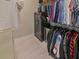 Walk-in closet features metal shelving, a safe, and a mini refrigerator at 7550 John Hancock Dr, Winter Garden, FL 34787
