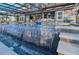 A sleek water feature adds elegance to the pool under an enclosure, with views to the outdoor living spaces at 7550 John Hancock Dr, Winter Garden, FL 34787