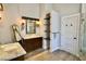 Bright bathroom features double vanity, open shelving, and a full length mirror with stylish decor at 787 High Grove Park Ct, Oviedo, FL 32765