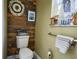 Charming bathroom with wood plank accent wall and decorative nautical accents at 787 High Grove Park Ct, Oviedo, FL 32765