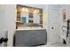 Bathroom featuring a modern double vanity, stylish lighting, and wood paneling at 787 High Grove Park Ct, Oviedo, FL 32765