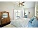 Bright bedroom with wooden furniture, high ceilings, and patio access at 787 High Grove Park Ct, Oviedo, FL 32765