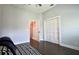 Bedroom with neutral paint, dark wood floor and modern closet space at 787 High Grove Park Ct, Oviedo, FL 32765