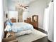 Bright bedroom with wooden furniture, high ceilings, and patio access at 787 High Grove Park Ct, Oviedo, FL 32765