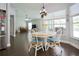 Cozy dining area with natural light, a round table and seating for four, open to the living area at 787 High Grove Park Ct, Oviedo, FL 32765