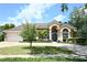 Stunning single-story home with a well-maintained lawn, inviting driveway, and desirable curb appeal at 787 High Grove Park Ct, Oviedo, FL 32765