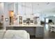 Spacious kitchen featuring a large island with granite countertops and seamless open-concept layout into the living area at 787 High Grove Park Ct, Oviedo, FL 32765