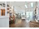 Spacious living room features hardwood floors, an open floor plan, and abundant natural light from skylights at 787 High Grove Park Ct, Oviedo, FL 32765