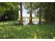 Scenic pond view featuring mature trees and a fountain, perfect for relaxing outdoors at 787 High Grove Park Ct, Oviedo, FL 32765