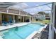 Spacious screened pool with ample lounge seating and clear blue water at 787 High Grove Park Ct, Oviedo, FL 32765
