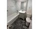 Bathroom featuring white tiled walls, modern fixtures, and stylish vanity with sink at 795 Temple Ave, Orange City, FL 32763