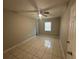 Bedroom featuring tiled flooring, neutral wall color and a window with natural light at 795 Temple Ave, Orange City, FL 32763