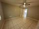 Spacious bedroom featuring tiled flooring, a ceiling fan and a neutral wall color at 795 Temple Ave, Orange City, FL 32763