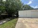 Outside of home featuring a door with foliage nearby at 795 Temple Ave, Orange City, FL 32763