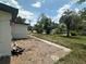 Well-maintained exterior with a pathway, beautiful trees and landscaping at 795 Temple Ave, Orange City, FL 32763