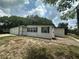 Charming single-story home showcasing mature trees and attractive curb appeal at 795 Temple Ave, Orange City, FL 32763