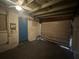 Garage featuring a blue door and rolling door at 795 Temple Ave, Orange City, FL 32763