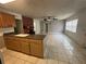 Spacious living room with tile flooring, seamlessly connected to the kitchen at 795 Temple Ave, Orange City, FL 32763