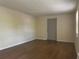 Unfurnished living room boasts neutral walls and laminate flooring at 795 Temple Ave, Orange City, FL 32763