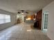 Inviting living room boasts tile floors and a kitchen, creating a welcoming space at 795 Temple Ave, Orange City, FL 32763