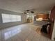 Inviting living room boasts tile floors and a kitchen, creating a welcoming space at 795 Temple Ave, Orange City, FL 32763