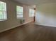 This living room has laminate flooring and lots of natural light at 795 Temple Ave, Orange City, FL 32763