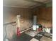 Interior view of a shed featuring a fire extinguisher and miscellaneous items at 795 Temple Ave, Orange City, FL 32763