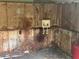 Utility room has connections for washer with aged walls at 795 Temple Ave, Orange City, FL 32763