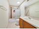 Bathroom features a single vanity, toilet and shower-tub combination with decorative tile surround at 806 Sterling Spring Rd, Orlando, FL 32828