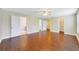 Bedroom showcasing hardwood flooring, a ceiling fan, and multiple entry points at 806 Sterling Spring Rd, Orlando, FL 32828