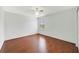Clean bedroom with hardwood floors, window, and ceiling fan at 806 Sterling Spring Rd, Orlando, FL 32828