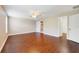 Large bedroom with hardwood flooring, ceiling fan, and ensuite bathroom access at 806 Sterling Spring Rd, Orlando, FL 32828