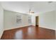 Spacious bedroom featuring hardwood floors, ceiling fan, and natural light at 806 Sterling Spring Rd, Orlando, FL 32828