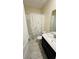 Well-lit bathroom with a shower and bathtub combination and modern vanity at 851 Drop Shot Dr, Davenport, FL 33896
