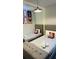 The bedroom features 2 twin beds with Disney decorations, and a comfy grey bench at 851 Drop Shot Dr, Davenport, FL 33896