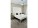 This spacious and modern main bedroom features a king-size bed and lots of natural light at 851 Drop Shot Dr, Davenport, FL 33896