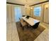 Beautiful dining room with a stunning chandelier and ample natural light at 851 Drop Shot Dr, Davenport, FL 33896