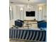 Sophisticated living room showcasing stylish seating and a decorative chandelier at 851 Drop Shot Dr, Davenport, FL 33896