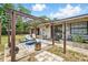 Backyard patio with pergola, outdoor seating, and charming decor, perfect for relaxing or entertaining at 1111 Liberty Ave, Mount Dora, FL 32757