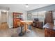 Open dining room featuring a wood table set and wood-look flooring at 1111 Liberty Ave, Mount Dora, FL 32757