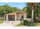 Inviting single-story home with a carport, lush greenery, and a cozy curb appeal at 1111 Liberty Ave, Mount Dora, FL 32757