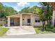 Charming single-story home features a carport and well-maintained landscaping at 1111 Liberty Ave, Mount Dora, FL 32757