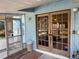 Exterior doors lead to a covered porch and the pool area at 11314 Huggins St, Leesburg, FL 34788