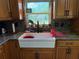 Kitchen sink with garden window featuring stainless appliances and granite countertops at 11314 Huggins St, Leesburg, FL 34788