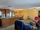 Open concept floor plan connecting the kitchen, dining area, and living room at 11314 Huggins St, Leesburg, FL 34788